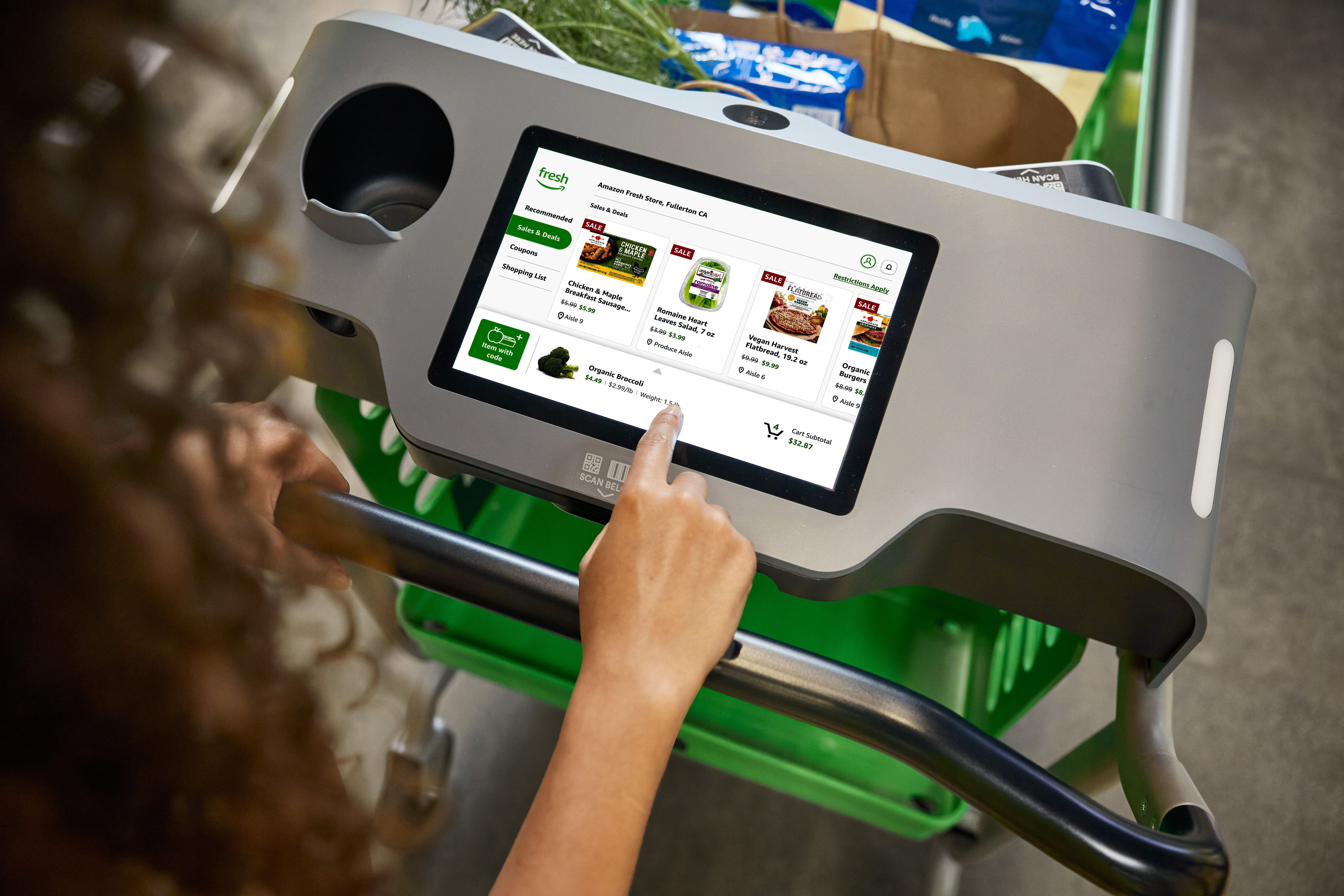 dash cart customer over the shoulder using touchscreen